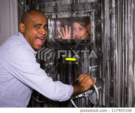 Man solving puzzles to get out of horror style room Man solving puzzles to get out of horror style room 117405106