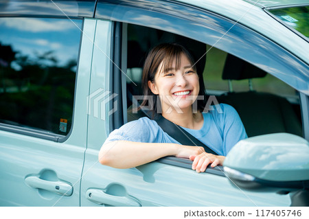 A woman driving a car A woman going for a drive 117405746