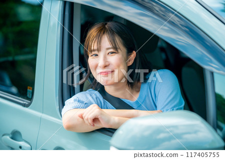 A woman driving a car A woman going for a drive 117405755