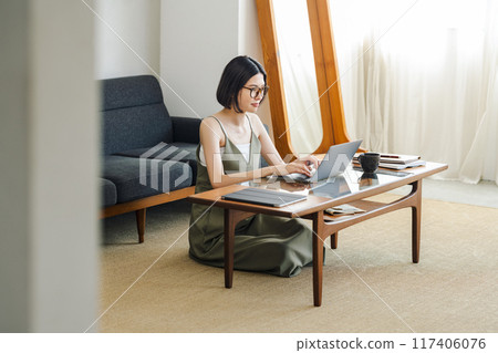 Woman doing telework at home Woman doing telework at home 117406076