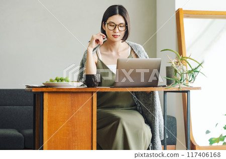 Woman doing telework at home Woman doing telework at home 117406168
