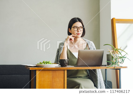 Woman doing telework at home 117406217