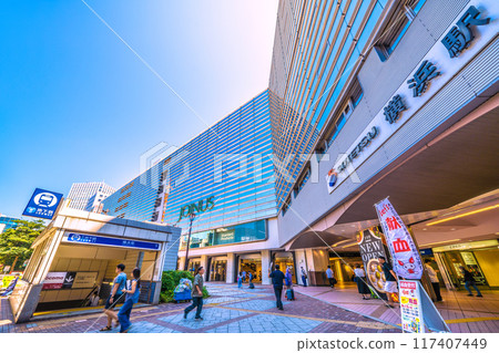 Yokohama cityscape in Japan in August. View of Sotetsu Yokohama Station and the Yokohama Municipal Subway Blue Line Yokohama Station entrance/exit. Due to the intense heat… 117407449