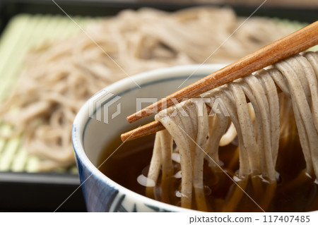 Soba noodles, pick up with chopsticks 117407485