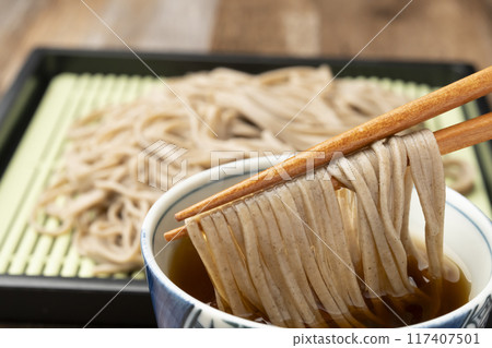 Soba noodles, pick up with chopsticks 117407501