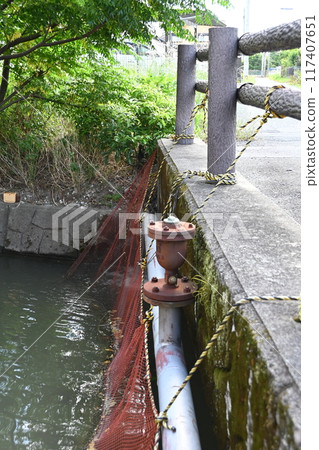Rural landscape with a canal and a small bridge Rural landscape with a canal and a small bridge 117407651