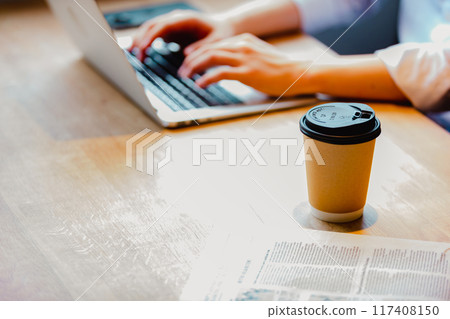 Image of a businesswoman working in a coworking space Image of a businesswoman working in a coworking space 117408150