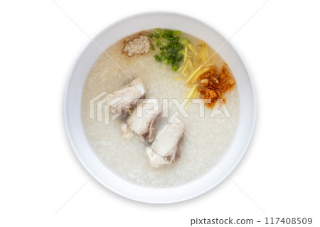 Sea bass congee is eaten with side dishes such as ginger, spring onion, and fried garlic. It is a healthy food. Sea bass congee is eaten with side dishes such as ginger, spring onion, and fried garlic. It is a healthy food. 117408509