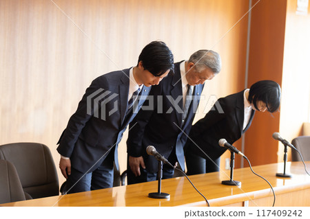 Politician round table dignified bow apology Politician round table dignified bow apology 117409242