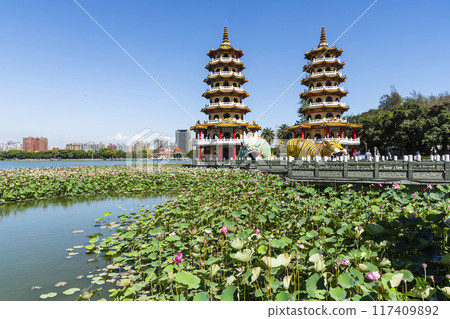 View of the lotus in bloom at the Dragon and Tiger Pagoda in Lotus Pond, Kaohsiung, Taiwan. 117409892