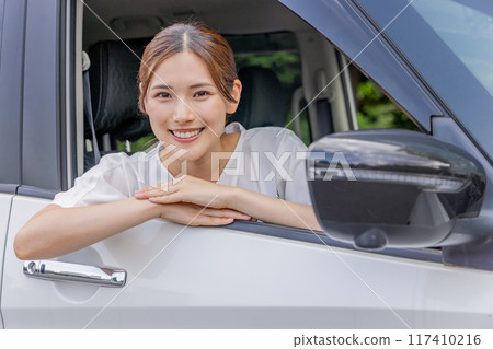 Young woman driving Young woman driving 117410216