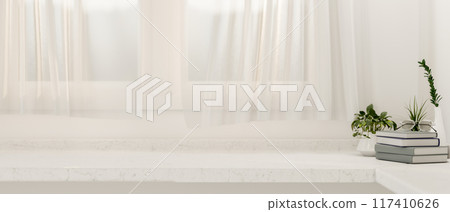 A copy space on a white table against the window with sheer curtains in a minimalist white room. 117410626