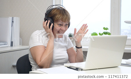 Young Woman Communicating via Video Call 117411372