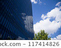 Looking up at the sky from the valley of the building 117414826