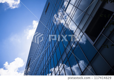 Clouds in the window of the building 117414829