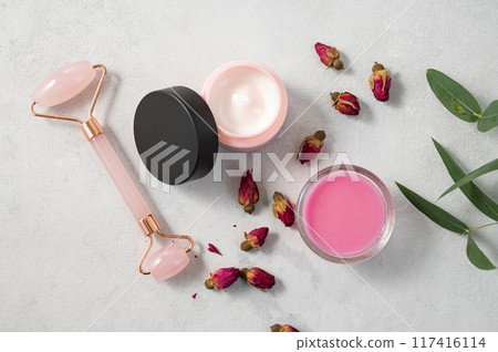 Face or body cream, soap and massager on a light background. The concept of care cosmetics Face or body cream, soap and massager on a light background. The concept of care cosmetics 117416114