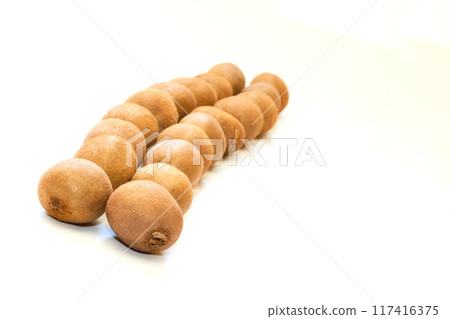 Several ripe tasty kiwis isolated on white Several ripe tasty kiwis isolated on white 117416375