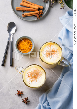 Turmeric golden milk latte with spices and honey. Detox, immunity boosting, anti-inflammatory 117416455