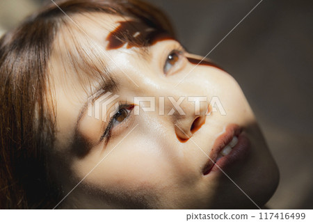 Beauty image of a woman lying on her back 117416499