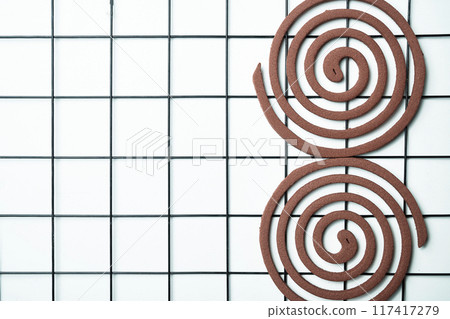 Mosquito coils with a brown center Mosquito coils with a brown center 117417279