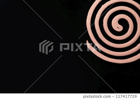 Mosquito coils on black background 117417729