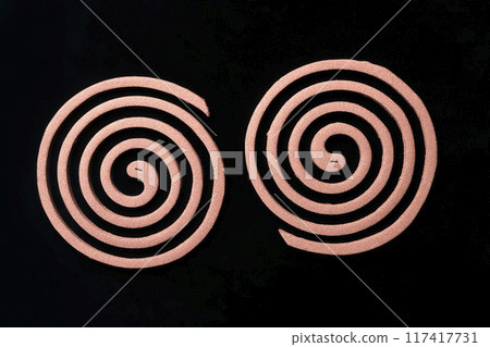 Mosquito coils on black background 117417731