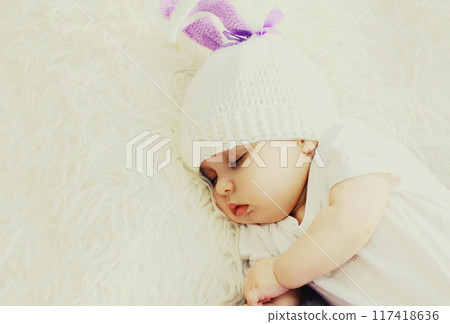 Close up portrait of cute baby sweet sleeping on bed at home Close up portrait of cute baby sweet sleeping on bed at home 117418636