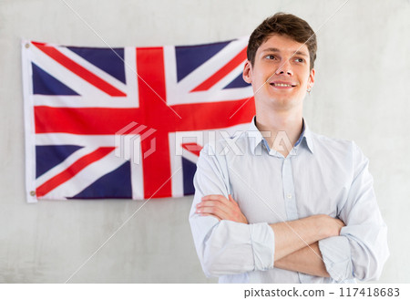 Young guy posing in front of UK flag Young guy posing in front of UK flag 117418683