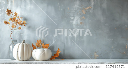 Home interior with grey concrete wall and a small floating wooden shelf featuring autumn decor elements. Seasonal design with copy space. 117419371