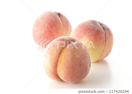Peaches photographed on a white background 117420294
