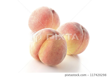 Peaches photographed on a white background 117420298