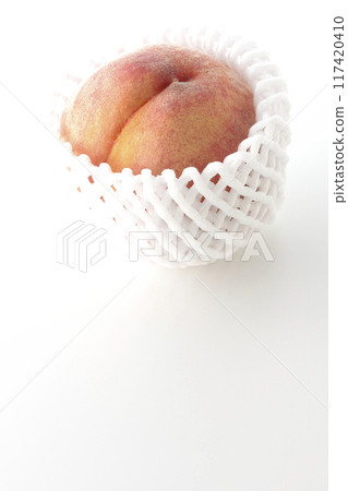 Peaches wrapped in cushioning material Peaches wrapped in cushioning material 117420410
