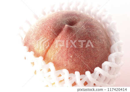 Peaches wrapped in cushioning material Peaches wrapped in cushioning material 117420414