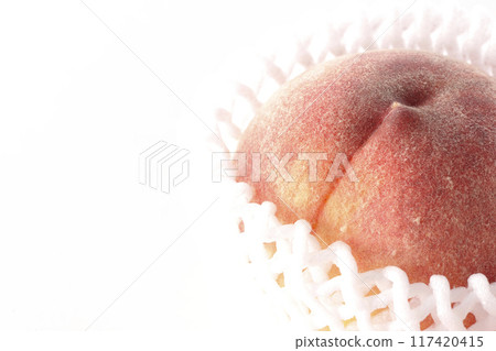 Peaches wrapped in cushioning material Peaches wrapped in cushioning material 117420415