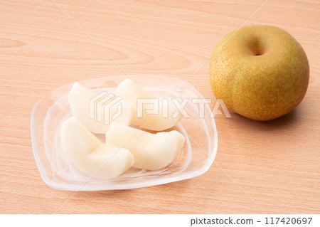 Pear cut into wedges 117420697