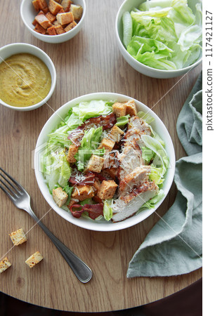 A bowl of Caesar salad A bowl of Caesar salad 117421127