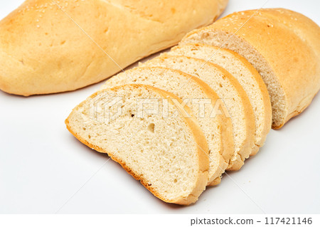 Freshly baked white bread loaf, sliced and ready to serve, perfect for sandwiches and breakfast 117421146