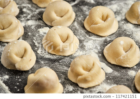 Handmade Ukrainian meat dumplings, ready for cooking, traditional varenyky with meat filling 117421151