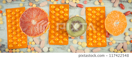 Natural fruits and medical pills 117422548