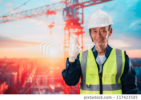 Elderly man supervising a high-rise building construction site Elderly man supervising a high-rise building construction site 117423585