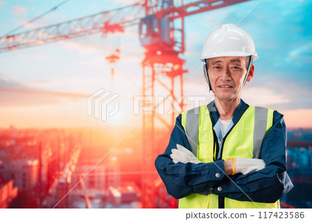 Elderly man supervising a high-rise building construction site Elderly man supervising a high-rise building construction site 117423586