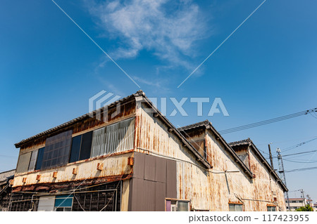 Retro textile factory with sawtooth roof Retro textile factory with sawtooth roof 117423955