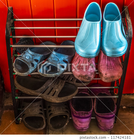 Dirty rubber shoes 117424181