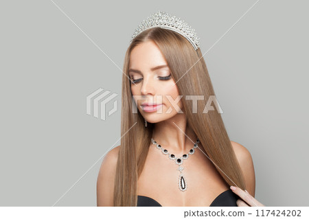 Glorious glamorous jewellery woman wearing jewelry crown tiara with diamond posing Glorious glamorous jewellery woman wearing jewelry crown tiara with diamond posing 117424202