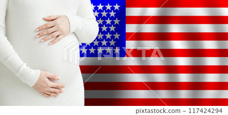 Beautiful pregnant woman belly against American flag background.  117424294