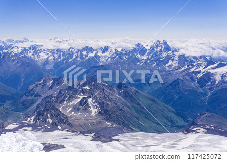 landscape of the high mountains above the clouds from the snowfield on the slope of Mount Elbrus landscape of the high mountains above the clouds from the snowfield on the slope of Mount Elbrus 117425072