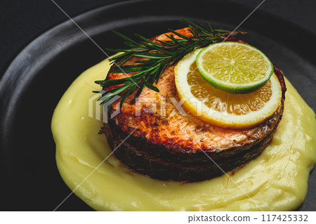 salmon steak, fried, mashed potatoes, top view, rosemary, lemon and lime, homemade, one serving, no people, salmon steak, fried, mashed potatoes, top view, rosemary, lemon and lime, homemade, one serving, no people, 117425332