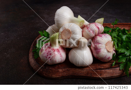 Fresh young garlic, white and purple color, on a wooden table, no people, 117425343