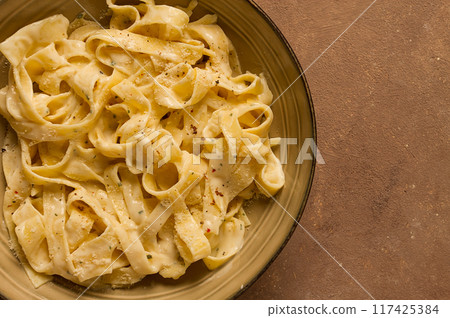 Fettuccine, tagliatelle, in creamy garlic sauce, Italian traditional cuisine, pasta carbonaro, Fettuccine, tagliatelle, in creamy garlic sauce, Italian traditional cuisine, pasta carbonaro, 117425384