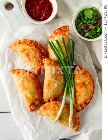 Fried chebureks, close-up, on a light background, no people, 117425399